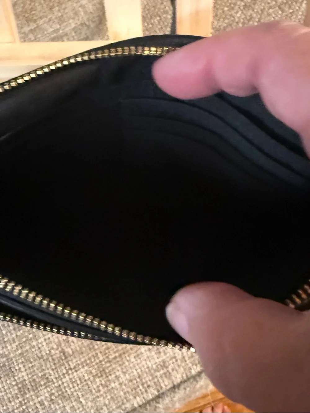 Coach Double Zip Wristlet crafted in black pebbled leather